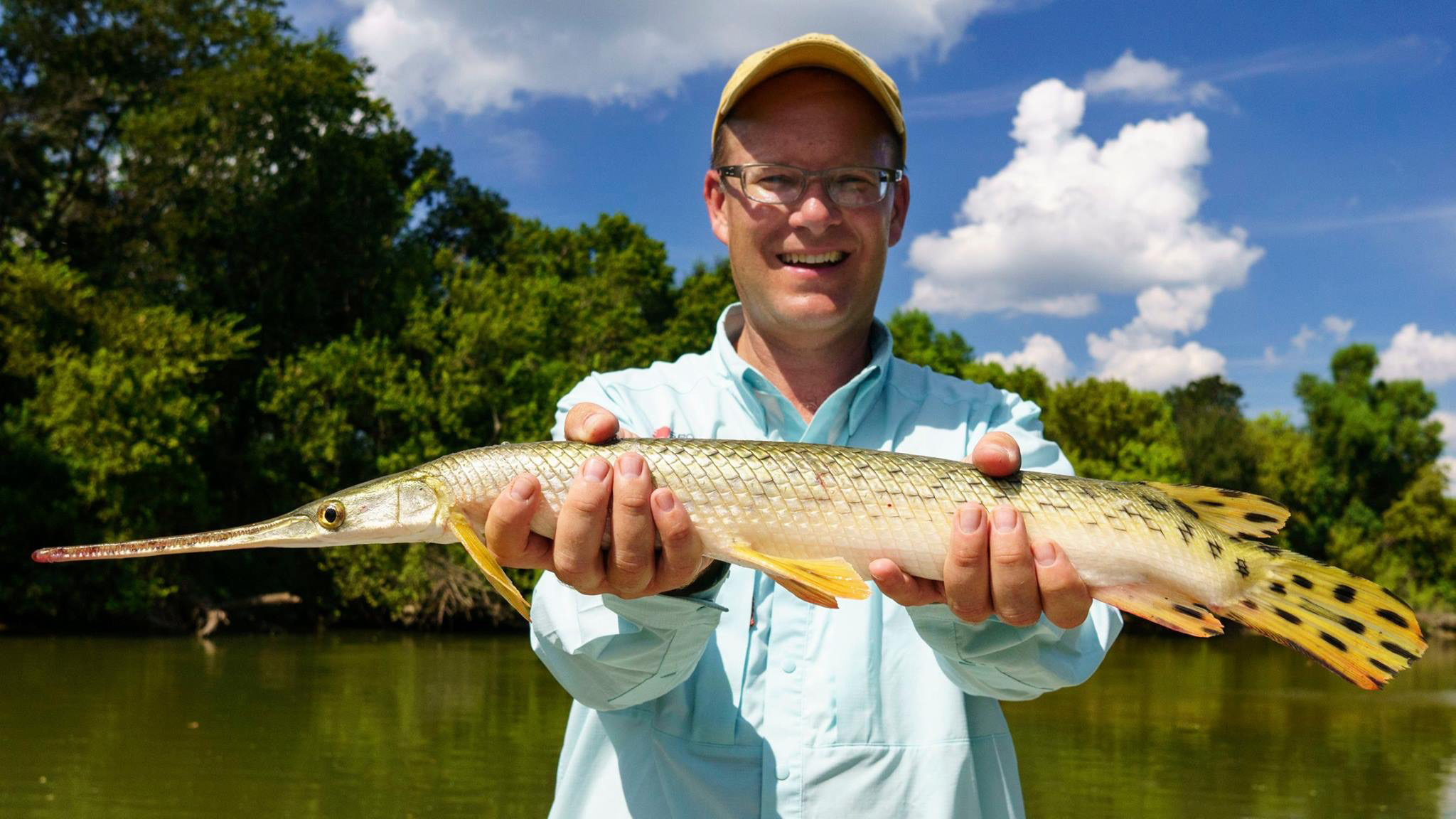 Matthew L. Miller with a longnose gar caught fly fishing