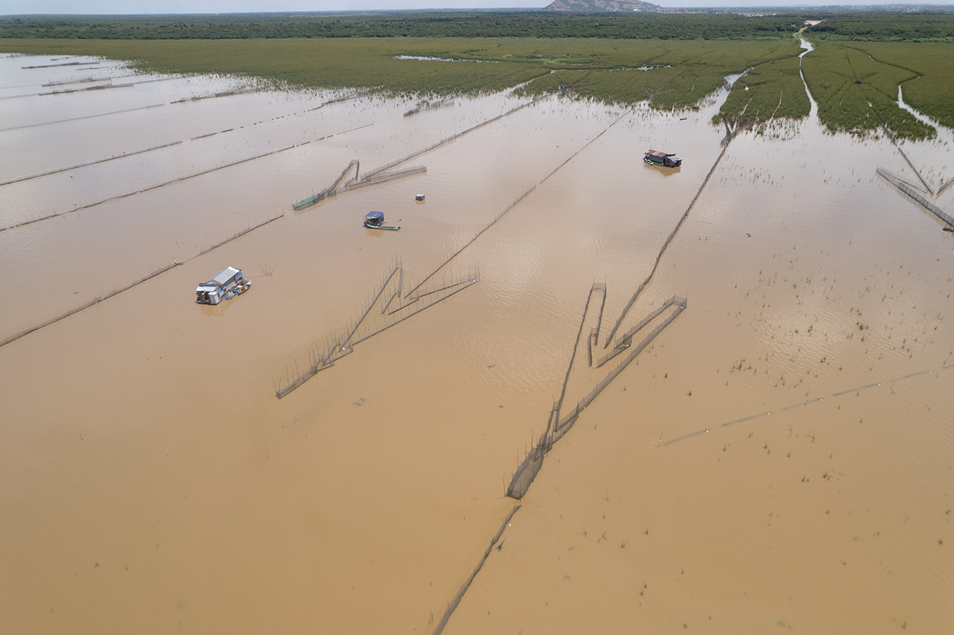 An aerial view of fisheries of the Tonle Sap, which look like big arrows on the lake. Conservation southeast asia. Credit Ben Hayes