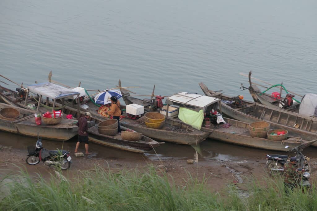 Fishing boats line the banks of the Mekong River that cuts through Kratie, Cambodia © IUCN Asia